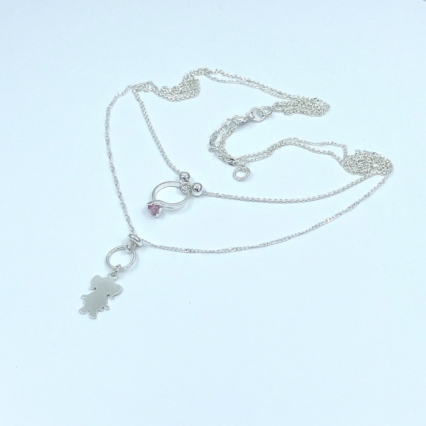 Collar Doble de Plata con Dije de Niña y de Anillo con Zirconia.