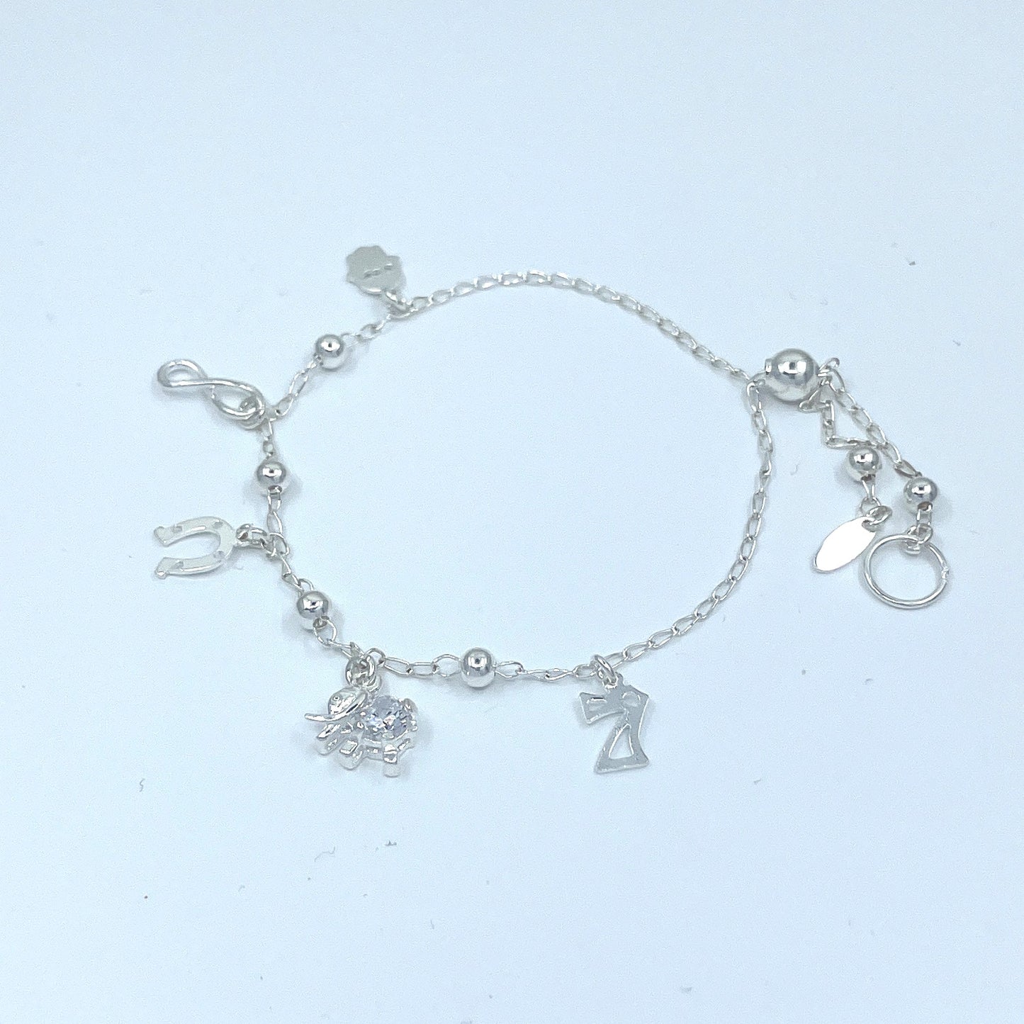 Pulsera de Plata de Buena Suerte con Infinito, Siete, Herradura, Mano y Elefante con Zirconia.