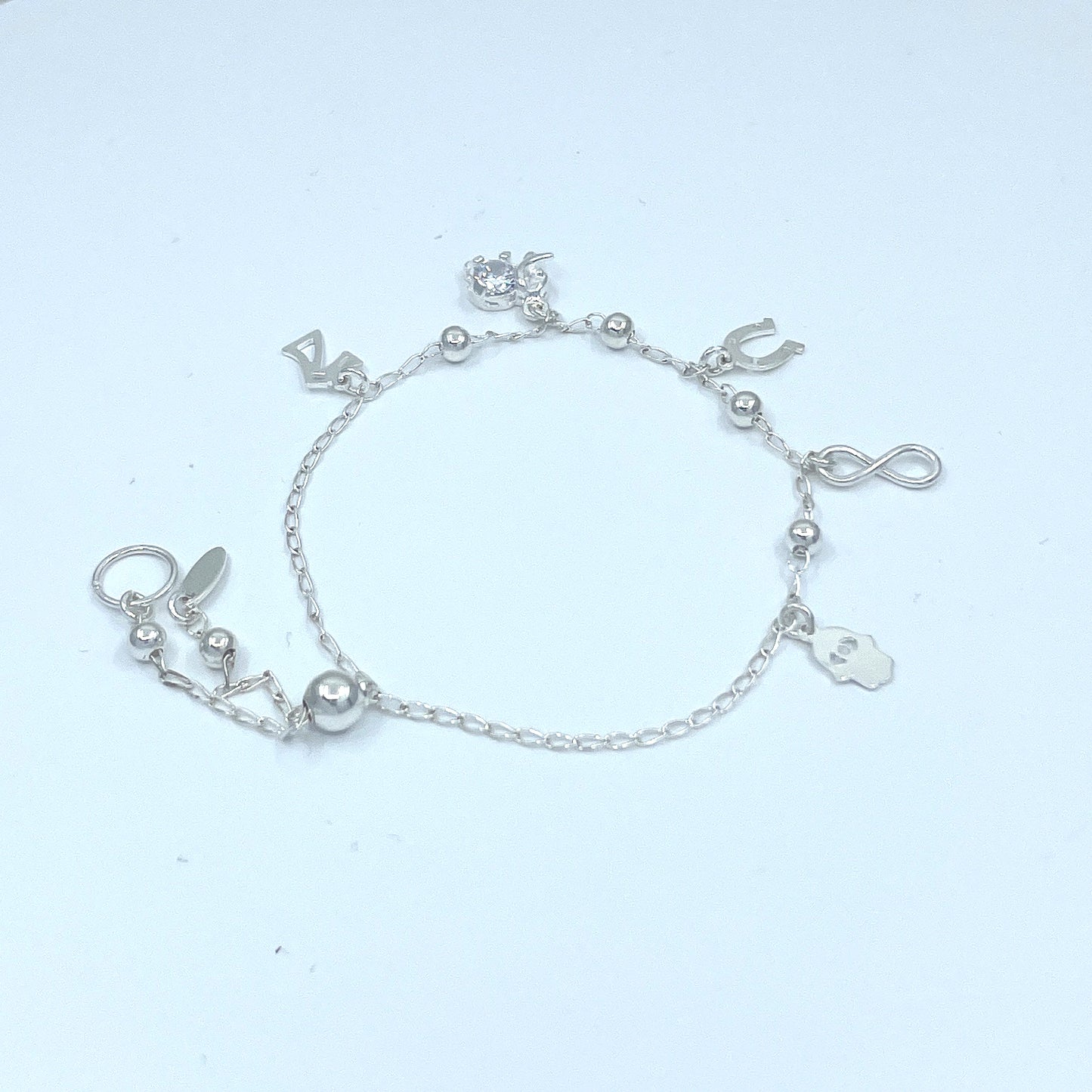 Pulsera de Plata de Buena Suerte con Infinito, Siete, Herradura, Mano y Elefante con Zirconia.