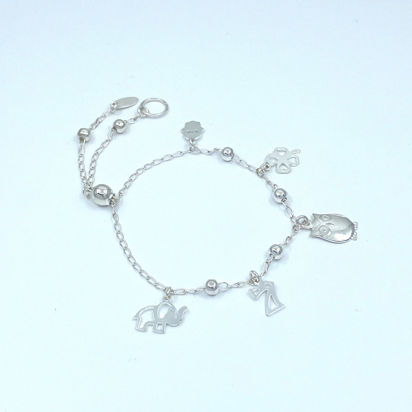 Pulsera de Plata de Buena Suerte con Trébol, Siete, Buho, Elefante y Mano.